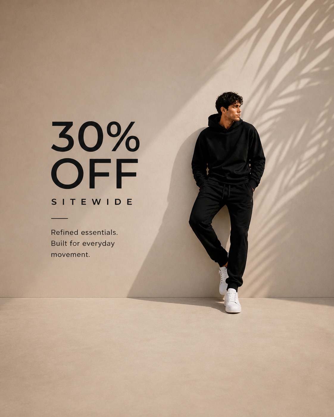 Man wearing a black hoodie with a promotional message for a 30% off sale on a beige background.