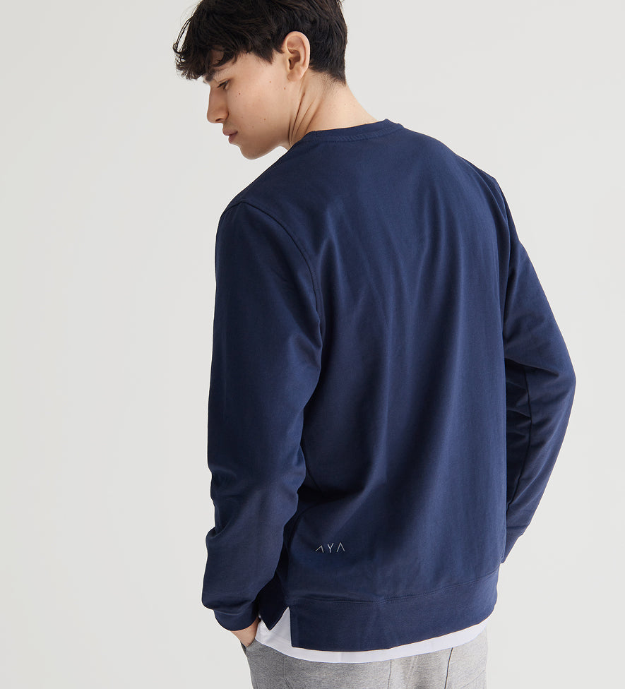 Person wearing a navy blue sweatshirt on a light gray background